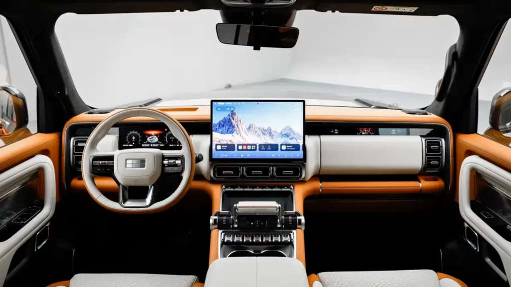 Wnętrze Geely Galaxy Starship 700 z jasną tapicerką i wielkim ekranem